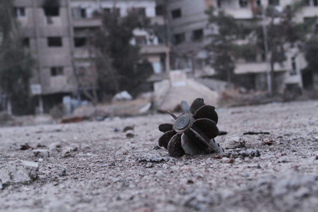 A piece of exploded mortar lies in a street in Daraya, a Syrian city southwest of Damascus, on Friday, January 17.