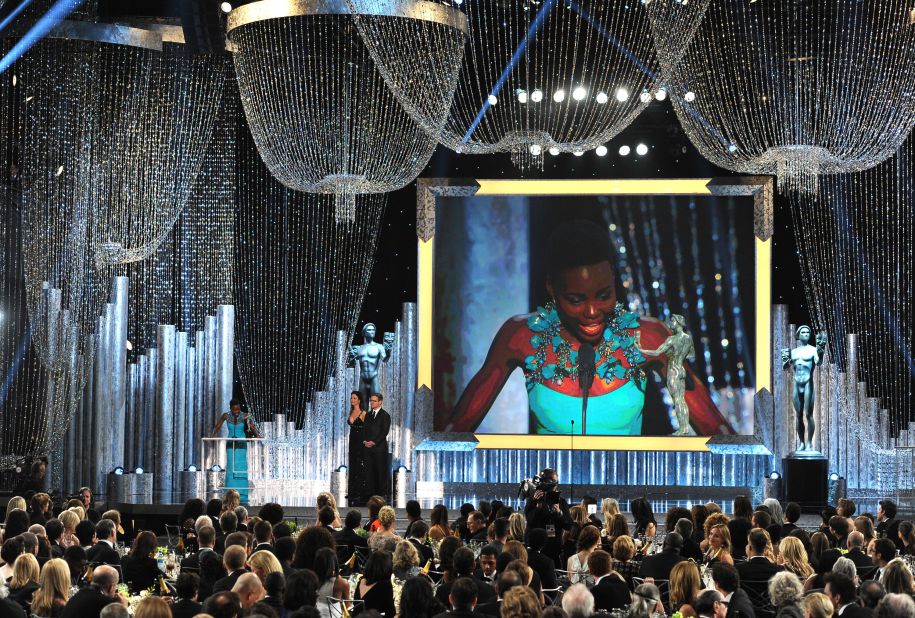 Lupita Nyong'o accepts the award for outstanding performance by a female actor in a supporting role for her part in "12 Years a Slave."