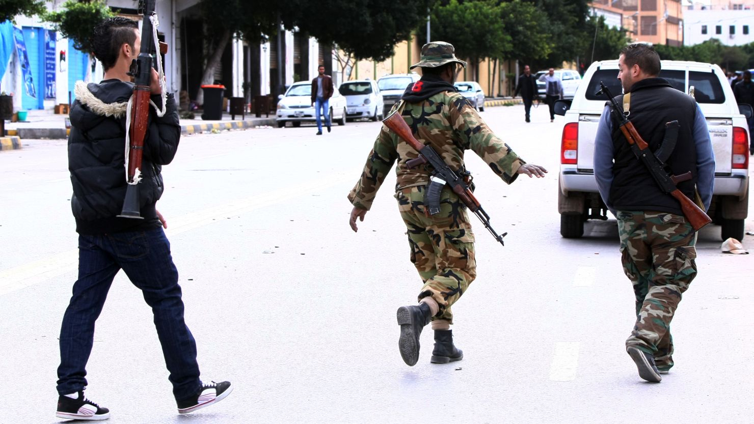 [File photo] Libyan gunmen roam along Zawiyah Street in the Libyan capital Tripoli on January 3, 2012.