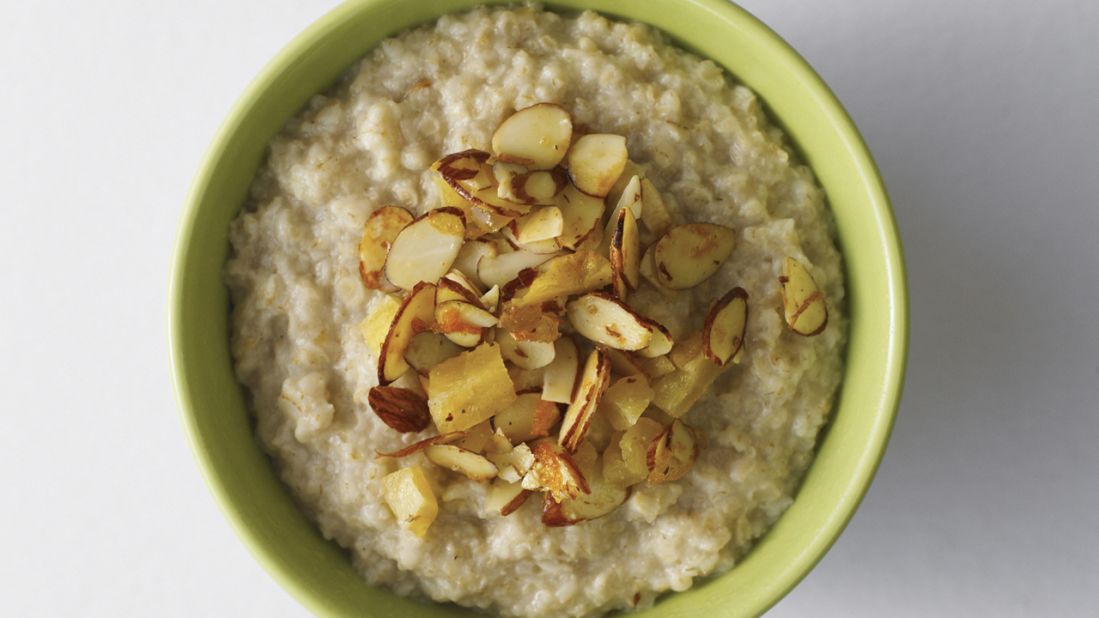 <strong>Oatmeal</strong><br /><br /><a href="http://www.health.com/health/gallery/0,,20306673,00.html" target="_blank" target="_blank">Oatmeal</a>'s filling force comes from its high fiber content and its uncanny ability to soak up liquid like a sponge. When cooked with water or skim milk, the oats thicken and take more time to pass through your digestive system, meaning you'll go longer between hunger pangs.<br /><br /><strong>Feel even fuller:</strong> Sprinkle almonds on top of your bowl. "The nuts pack protein and fiber and contain unsaturated fats that can help stabilize insulin levels," regulating blood sugar, Katz says.<br /><br /><a href="http://www.health.com/health/gallery/0,,20735735,00.html" target="_blank" target="_blank">Health.com: 13 comfort foods that burn 
