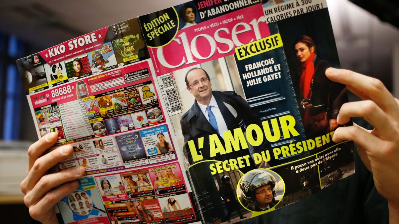 A man reads the French magazine Closer, which exposed President Francois Hollande's affair with actress Julie Gayet, backing its  claim with photographs.