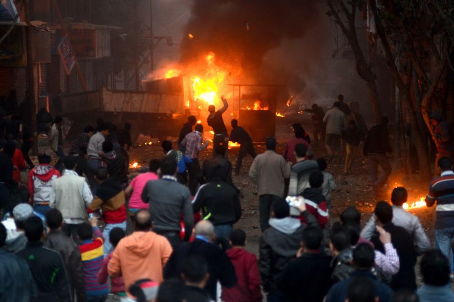 Protesters and Egyptian riot police clash in Cairo on January 17, as the country awaits the results of a constitutional referendum. On January 18, the electoral commission announced the constitution had overwhelmingly been approved.