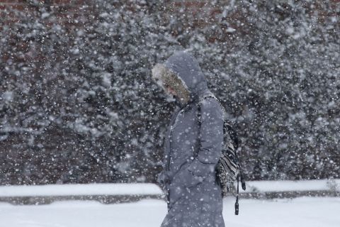 A woman walks through a snow storm on January 21 in south Philadelphia.