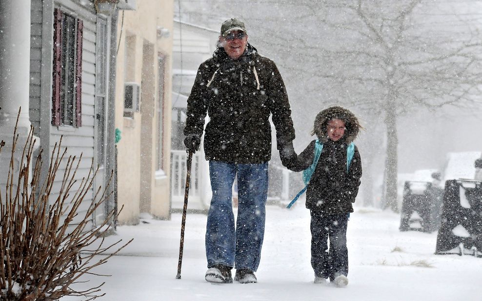 Tony Ciambrello and his granddaughter Addie Maurer walk home from St. Mark's Catholic School in Bristol Borough, Pennsylvania, on January 21.