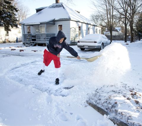 Antione Larkins shovels snow out of his driveway in Champaign, Illinois, on January 21.