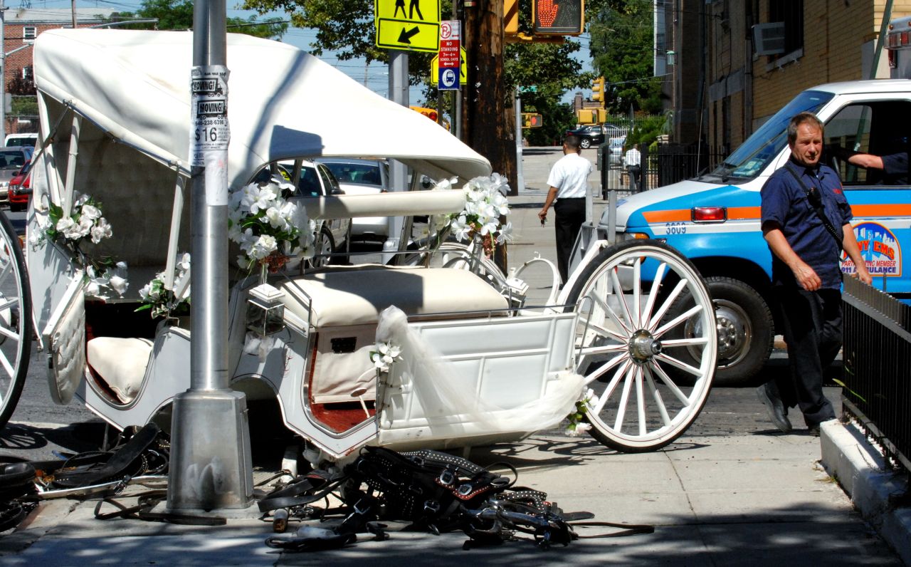 A carriage drawn by two horses on its way to pick up a wedding party was smashed when it was struck by a livery cab in Brooklyn in 2008. The driver and horses were injured. 