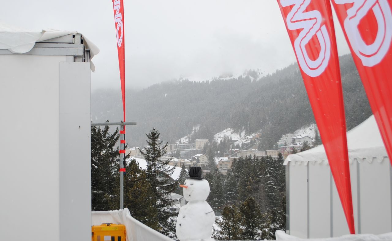 The traditional World Economic Forum snowman stands guard outside CNN's live position.