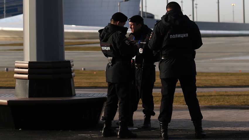 Security personnel look talk in the Olympic Park in the Coastal Cluster on January 9, 2014 in Alder, Russia.