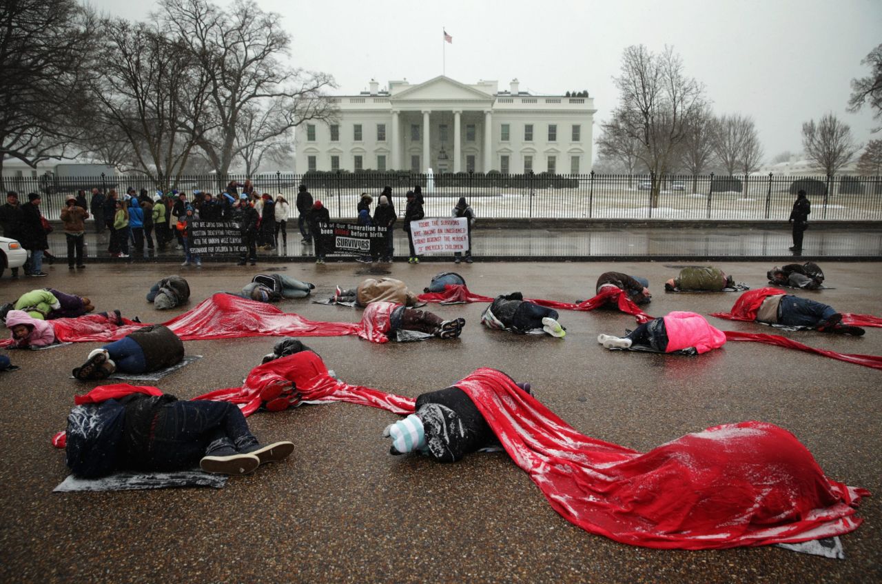 Anti-abortion activists participate in a "Memorial Die-in" outside the White House on Tuesday, January 21. People from all around the country are planning to gather in Washington for the annual March for Life on Wednesday to protest the Roe v. Wade Supreme Court decision in 1973 that helped to legalize abortion in the United States. Take a look back at the annual rally through the years: