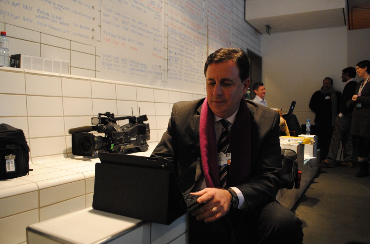 John Defterios putting the final touches to his Global Exchange show in CNN's makeshift Davos bureau.