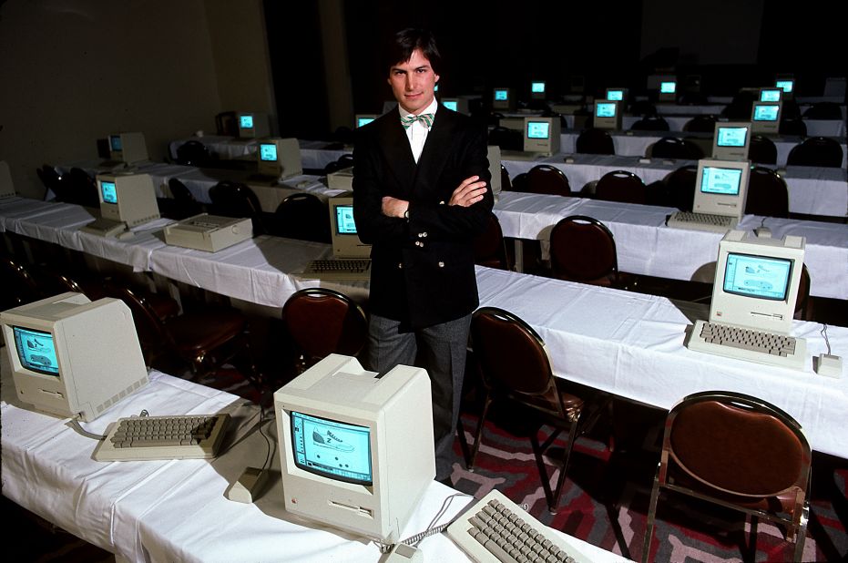 Jobs poses in 1984 with a room full of original Macintoshes. The machine packed 128K of memory -- tiny by today's standards -- and sold for $2,495.
