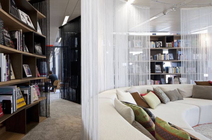 Designers didn't want any particular aesthetic to dominate the building, so interiors move from quirky and colorful to sleek and stylish. The modern library, for instance, offers a tranquil atmosphere dominated by a circular sofa.