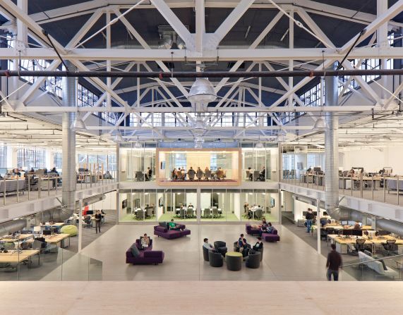 Atlassian, the Australian software company, honors the idea of transparency with its glass offices in San Francisco. The central plaza above is used for socializing. For more formal gatherings, employees head to meetings rooms that pop with brightly colored carpets and furniture. 