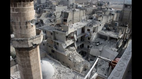Buildings lie in ruins in Aleppo on Sunday, January 19, after reported air raids by Syrian government planes.