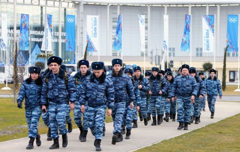 About 37,000 security officers will be deployed for the Sochi Games. Police officers walk in front of the main press center at the Olympic Park in Sochi on January 7, 2014.
