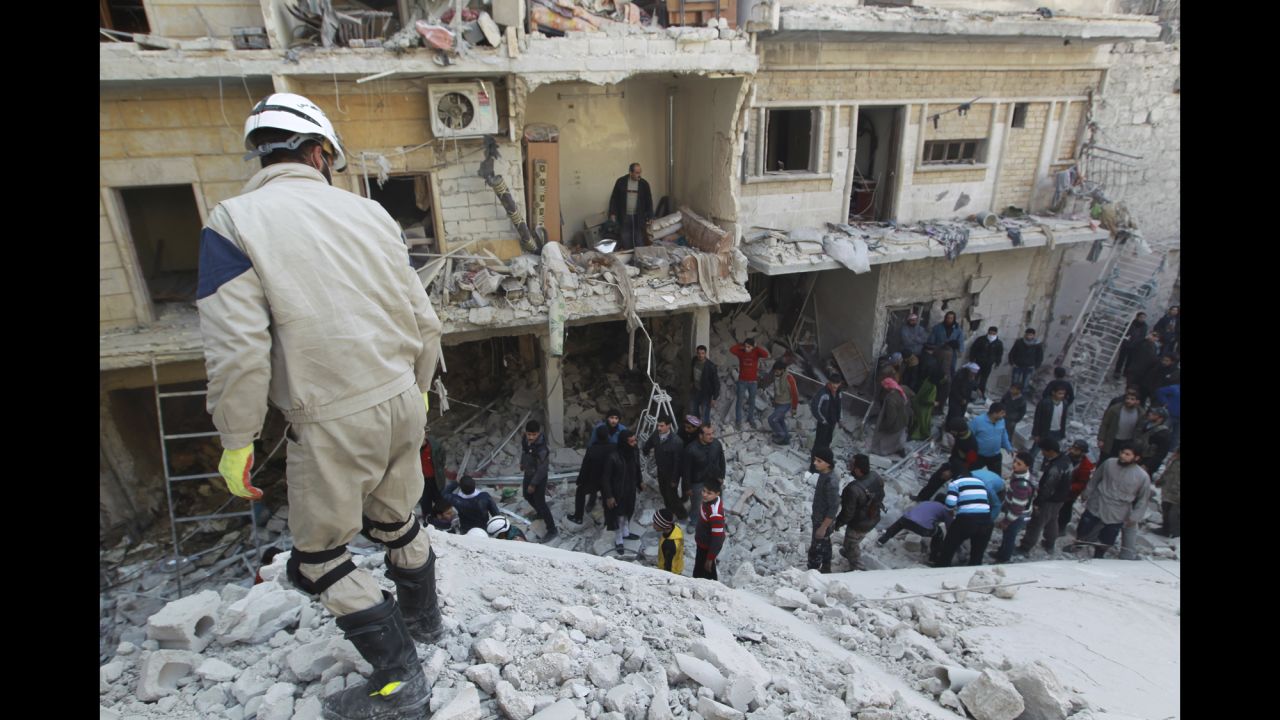 Residents search for survivors in Aleppo on Saturday, December 28, 2013, after what activists said were airstrikes by forces loyal to Syrian President Bashar al-Assad. 