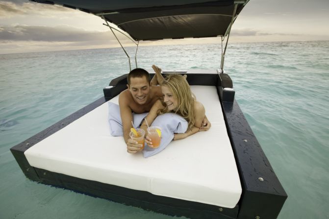 At the Ritz-Carlton, guests pick up the coconut phone to request delivery of sunscreen, magazines, food and drinks from the aqua butler.