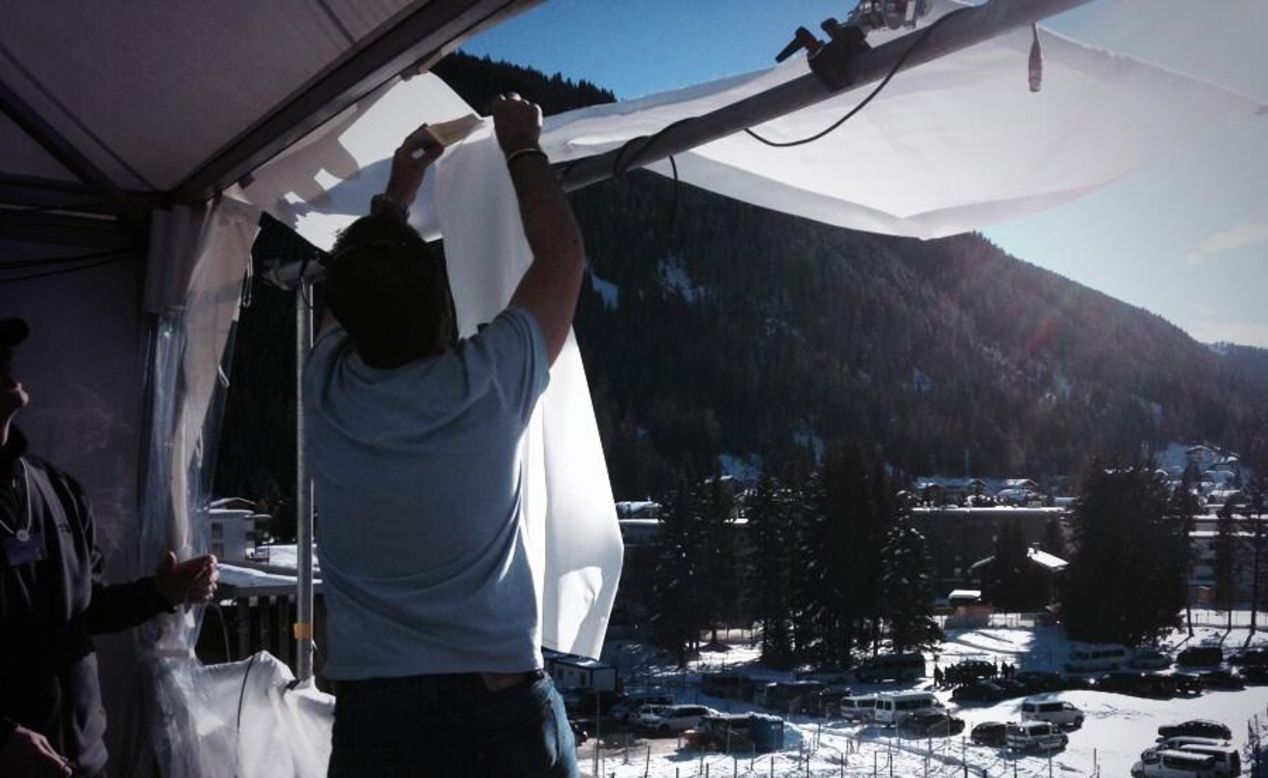 Team CNN is down to t-shirts in Davos on Wednesday, putting up makeshift sunshades in the mountains.