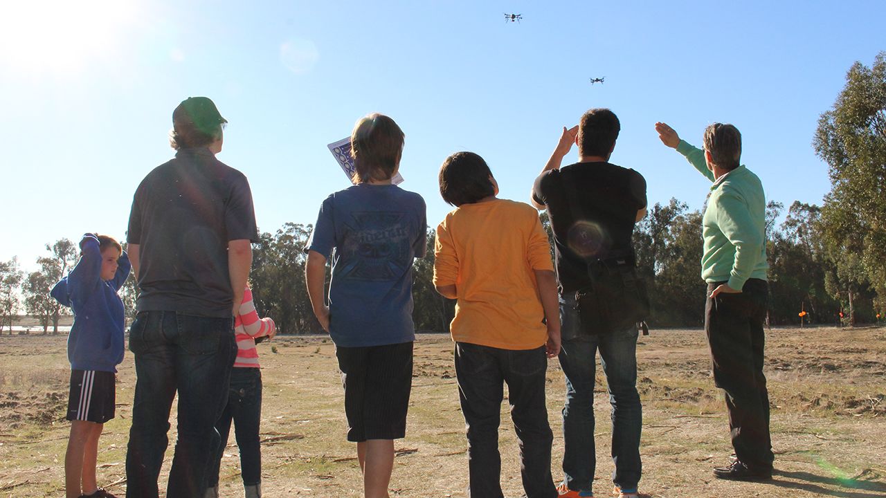 Drone hobbyists watch a pair of the aircraft take to the air at a recent Make Drone "Fly-In" event in American Canyon, California. Click through for more scenes of drones and their human masters.