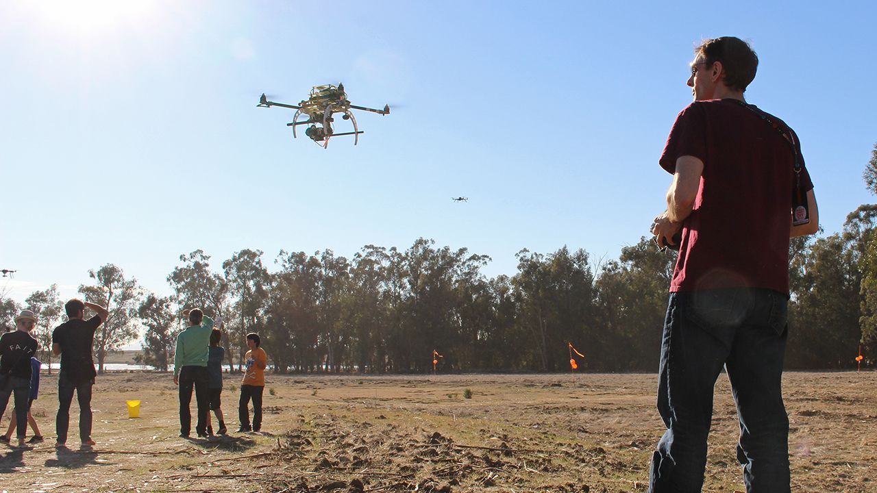 An enthusiast takes a drone, outfitted with a camera, for a spin in the test flight area. Aerial photography is one of the most popular uses for smaller consumer drones.