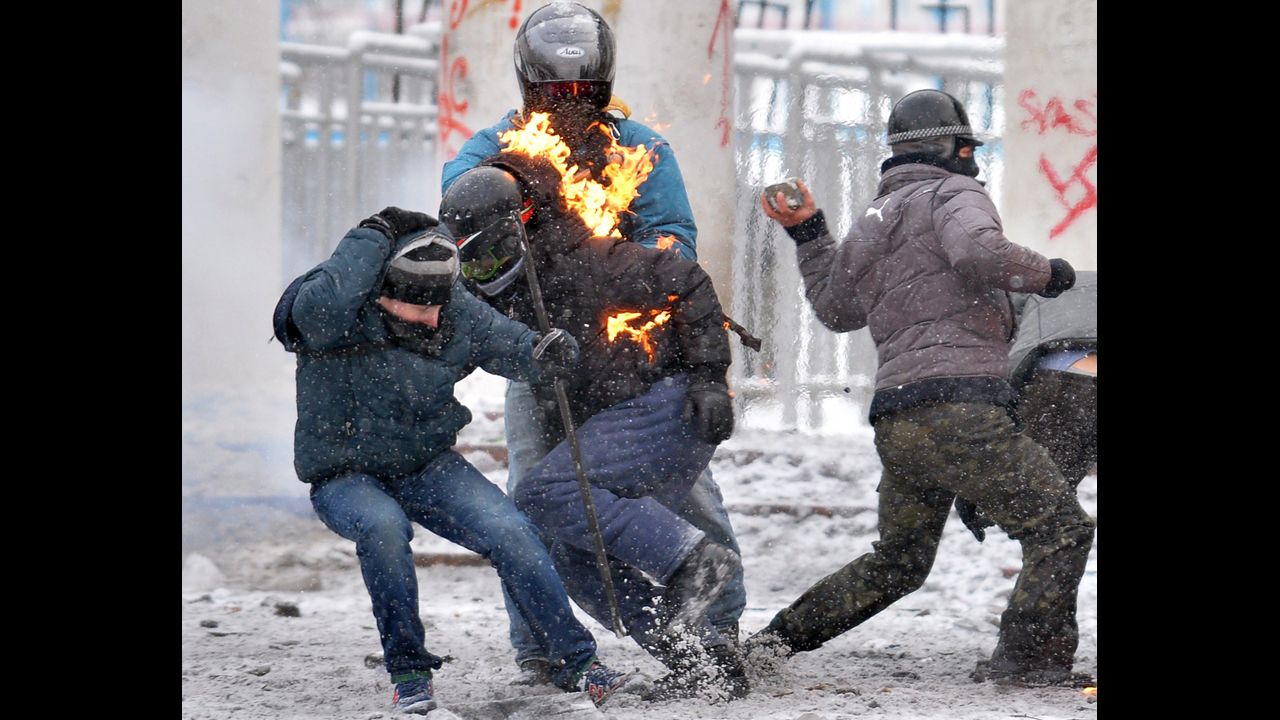 Flames leap off a protester during clashes with police on January 22.