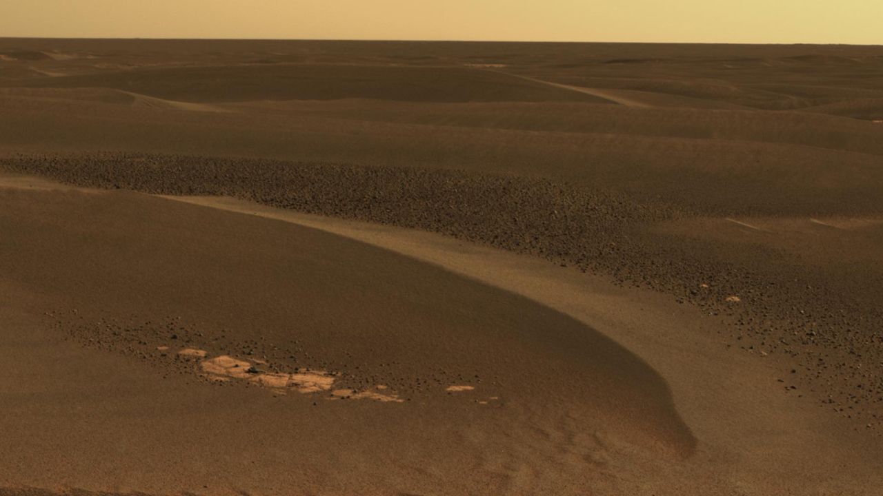 The Opportunity rover has studied windblown ripples in an area called the Meridiani Planum. This image, taken on April 27, 2006, shows a field of rocks known as cobbles among ripples about 8 inches high. The windblown ripples are likely left from a time when wind patterns were different,<strong> </strong>said planetary scientist Ray Arvidson.