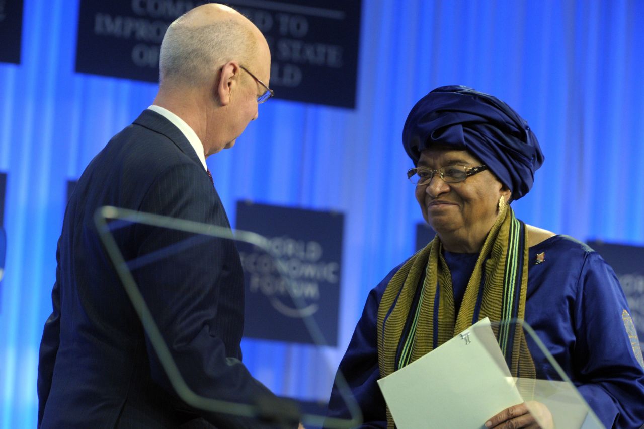 WEF Executive Chairman Klaus Schwab shakes hands with Liberia's President Ellen Johnson-Sirleaf.