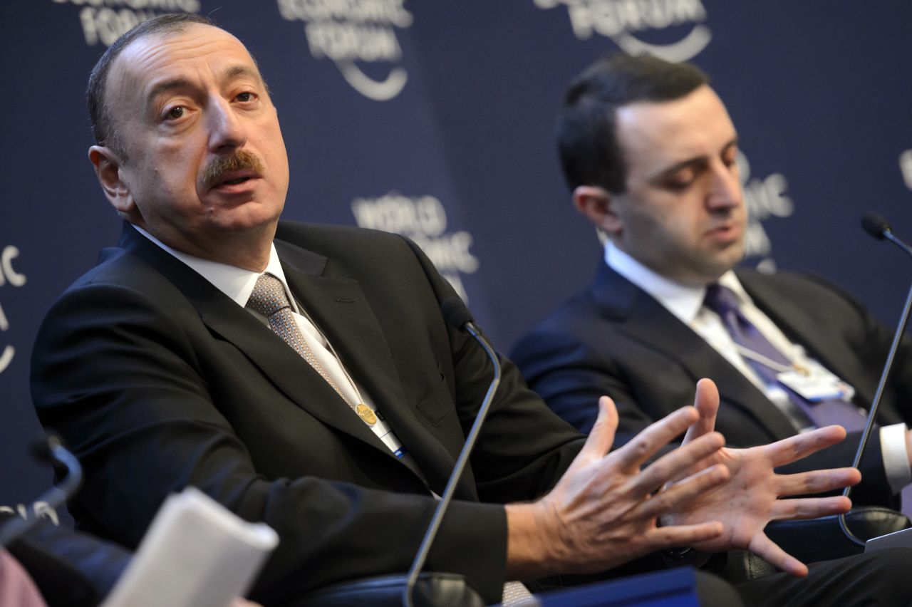 Ilham Aliyev, left, President of Azerbaijan, speaks next to Irakli Garibashvili, right, Prime Minister of Georgia, during a panel session on the second day of the meeting.