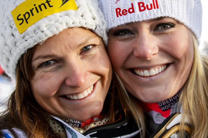 Normally U.S. teammates, Julia Mancuso (left) will be the one going for gold in Sochi while the injured Lindsey Vonn (right) will watch at home as a TV correspondent.
