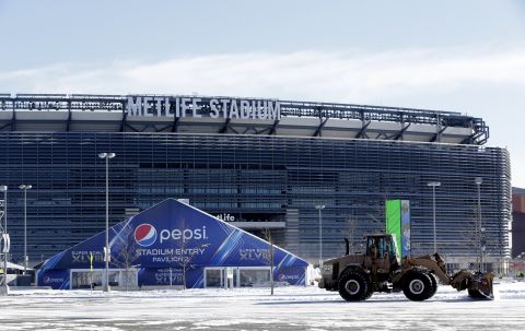 A tractor plows snow at MetLife Stadium on Wednesday, January 22.