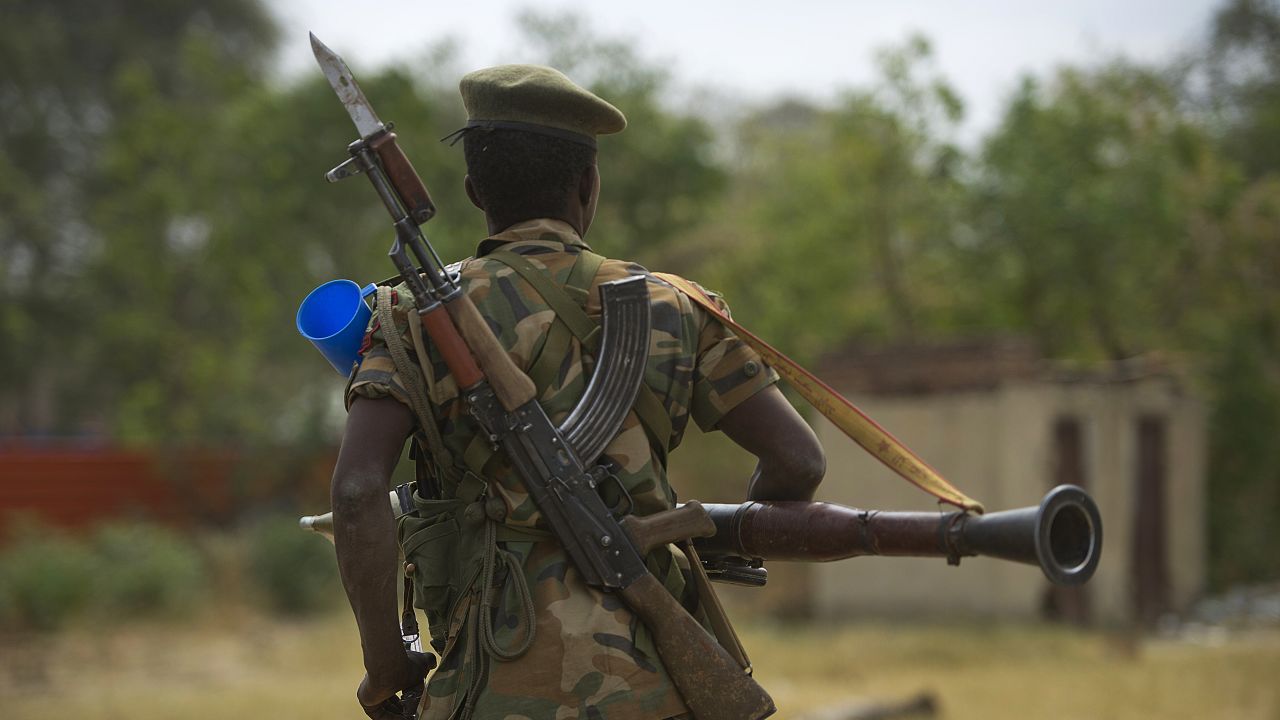 South Sudanese People Liberation Army (SPLA) soldier patrols in Malakal on January 21, 2014. Pressure mounted on South Sudan's warring parties Tuesday to reach a ceasefire to end weeks of bitter fighting and atrocities on both sides that have devastated the young nation.Thousands have been killed and half a million civilians forced to flee the fighting between troops loyal to President Salva Kiir and rebels allied to his sacked deputy Riek Machar. AFP PHOTO / HARRISON  NGETHI        (Photo credit should read HARRISON NGETHI/AFP/Getty Images)