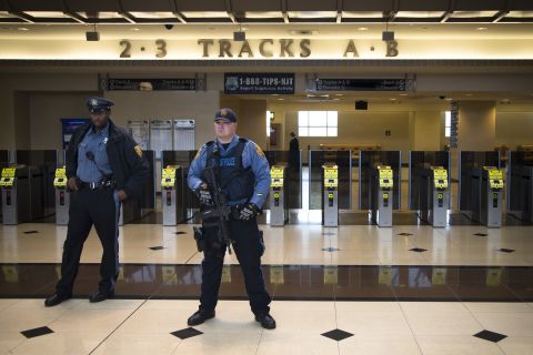 New Jersey Transit Police in Secaucus, New Jersey, stand watch over a news briefing Thursday, December 9, concerning transportation to the Super Bowl.