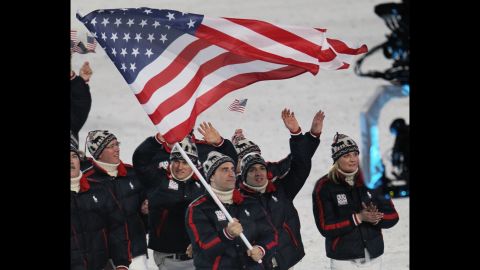 U.S. athletes at the 2010 Winter Olympics in Vancouver, British Columbia. Luger Mark Grimmette carries the flag in the opening ceremony.