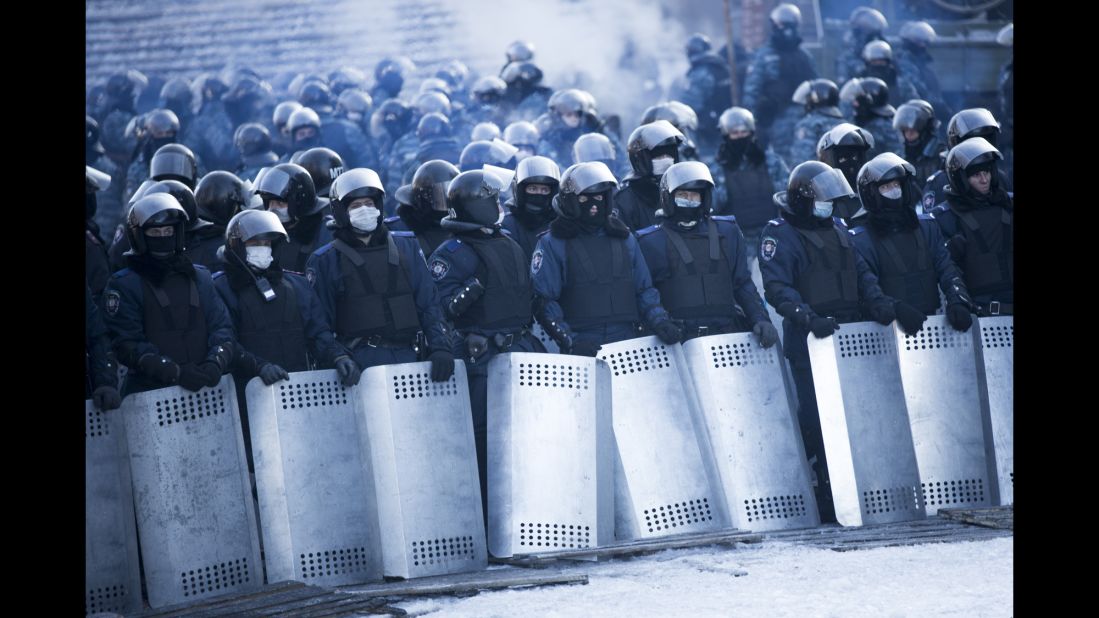 Riot police stand guard near Dynamo Stadium on January 24.
