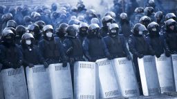 Riot police stand guard near Dynamo Stadium in Kiev on January 24.