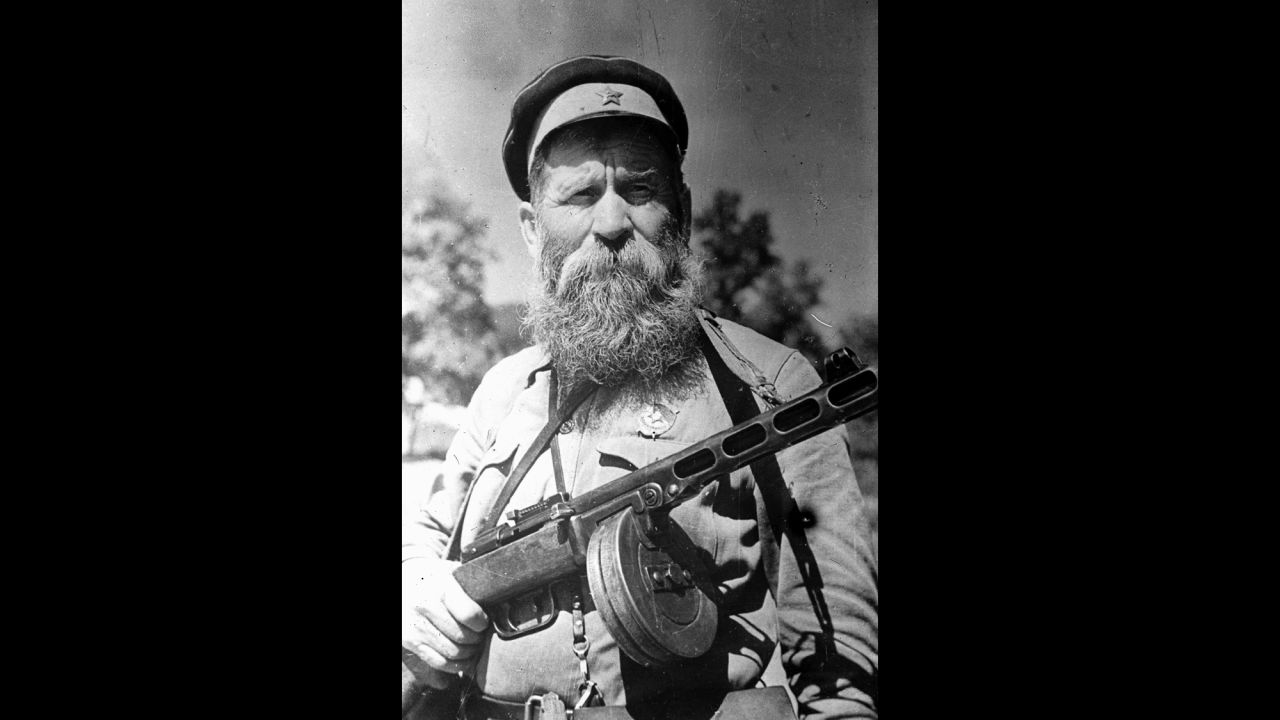When World War II broke out, Cossack soldiers fought on both sides.  This 1943 photo shows a 64-year-old Russian Cossack decorated for gallantry and leadership with the order of the red banner  