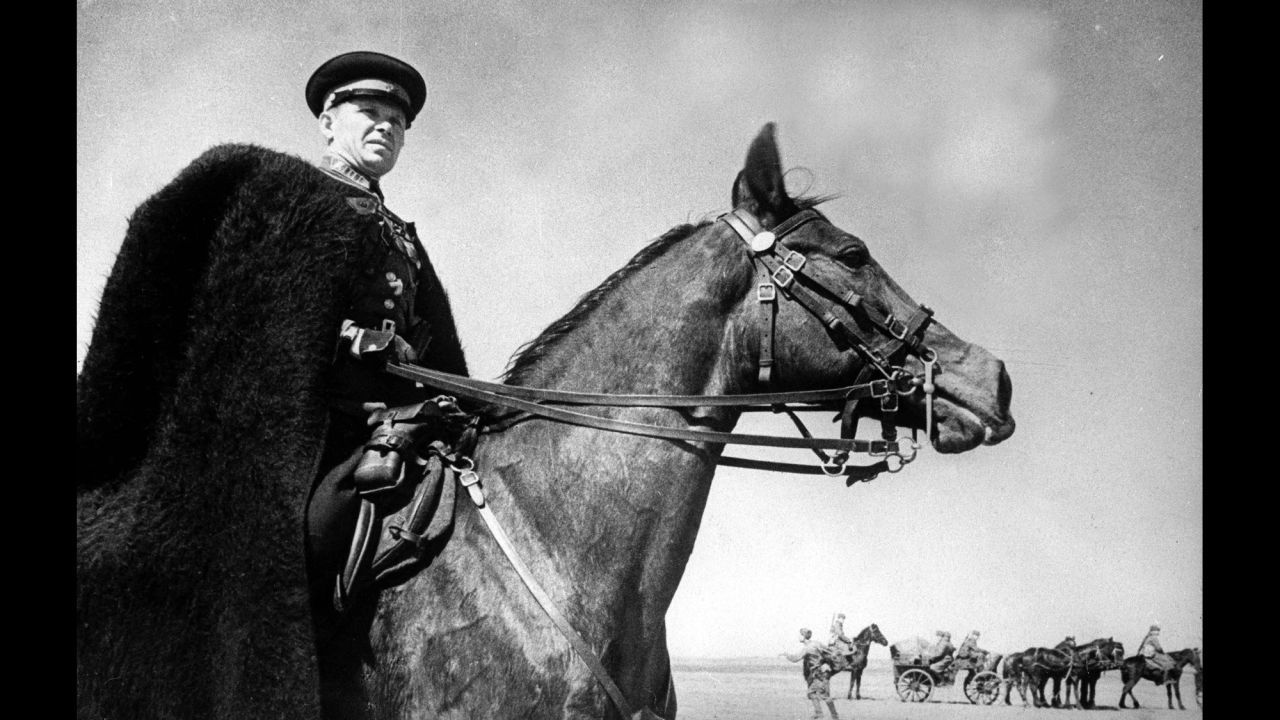 The commander of a Cossacks unit on Russia's southwestern front watches the progress of his troops during World War II in August 1942.