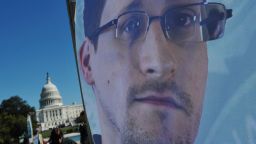 An image of Edward Snowden on the back of a banner is seen infront of the US Capitol during a protest against government surveillance on October 26, 2013 in Washington, DC.