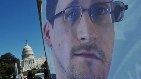 An image of Edward Snowden on a banner is seen in front of the US Capitol on October 26, 2013 in Washington, DC.
