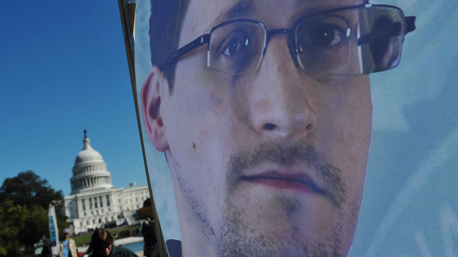 An image of Edward Snowden on the back of a banner is seen infront of the US Capitol in October 2013.