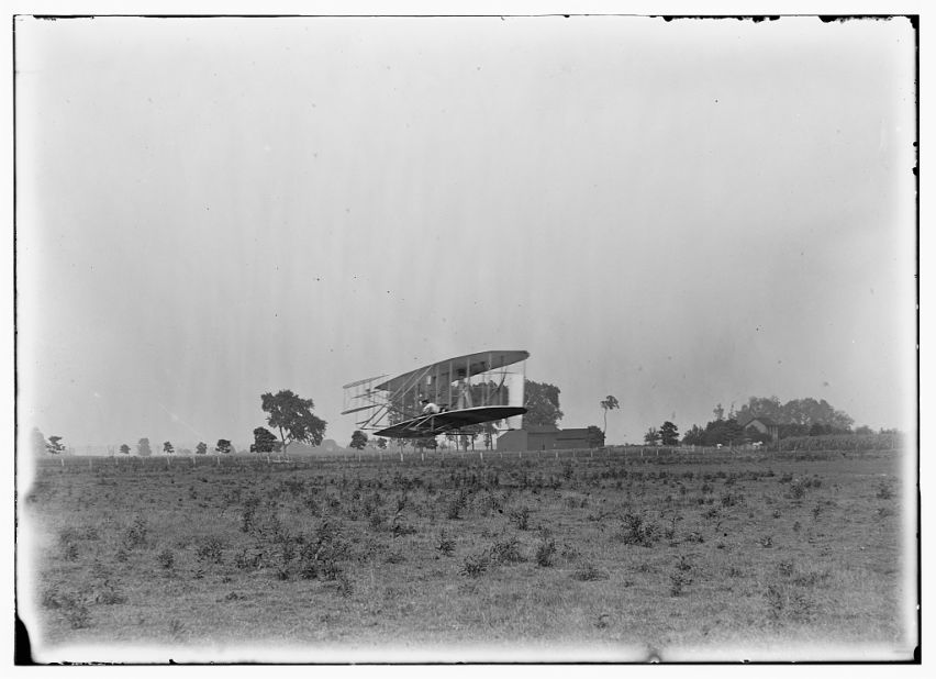 In this photo from around 1904, Orville Wright pilots an aircraft across Ohio's Huffman Prairie Flying Field, covering a distance of 356 feet. After making history at Kitty Hawk, North Carolina, the Wrights developed "a practical and usable machine" in this pasture, said U.S. Park Ranger Robert Petersen. "This is the Holy Grail. This is literally where aviation gets its start." The landowner asked the Wrights to move any horses and cows out of the way before doing any flying, Petersen said. "Sometimes there were issues."