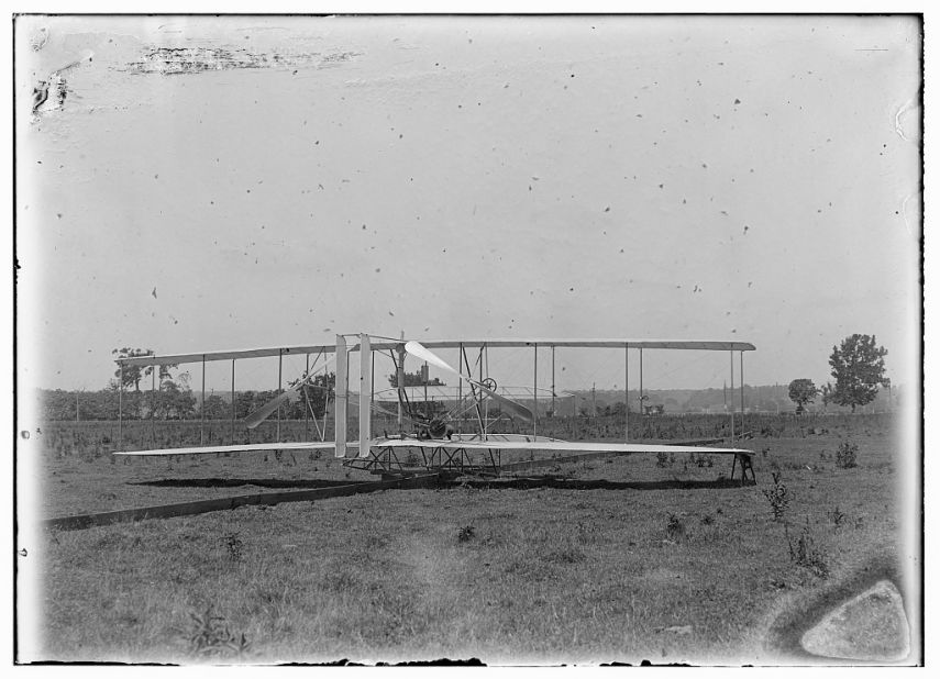 The Wright brothers' flying machine got airborne over the field via a launching track, left, that was attached to a catapult system. 