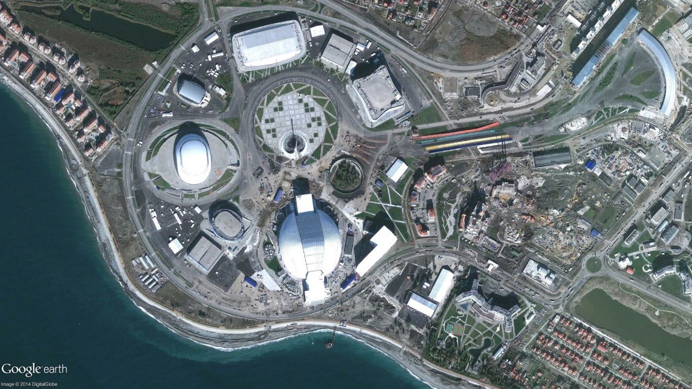From the top center, going clockwise: the large rectangular building is the Adler Arena Skating Center, the smaller squarish building is a training rink for figure skating, then the Iceberg Skating Palace, the round dome near the bottom center is the Fisht Olympic Stadium, and the smaller white-topped building is the Bolshoy Ice Dome. 