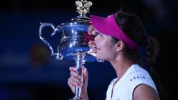 Li Na clutches the Daphne Akhurst Memorial Cup following her triumph in Melbourne on Saturday.