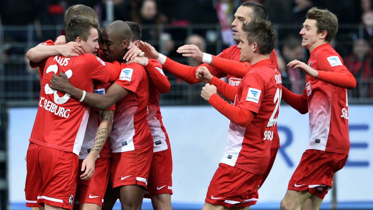 Freiburg's players celebrate scored their second goal against Leverkusen on Saturday. 
