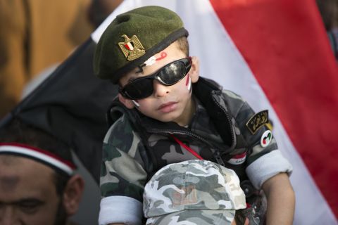 A boy is seen during a rally marking the anniversary.