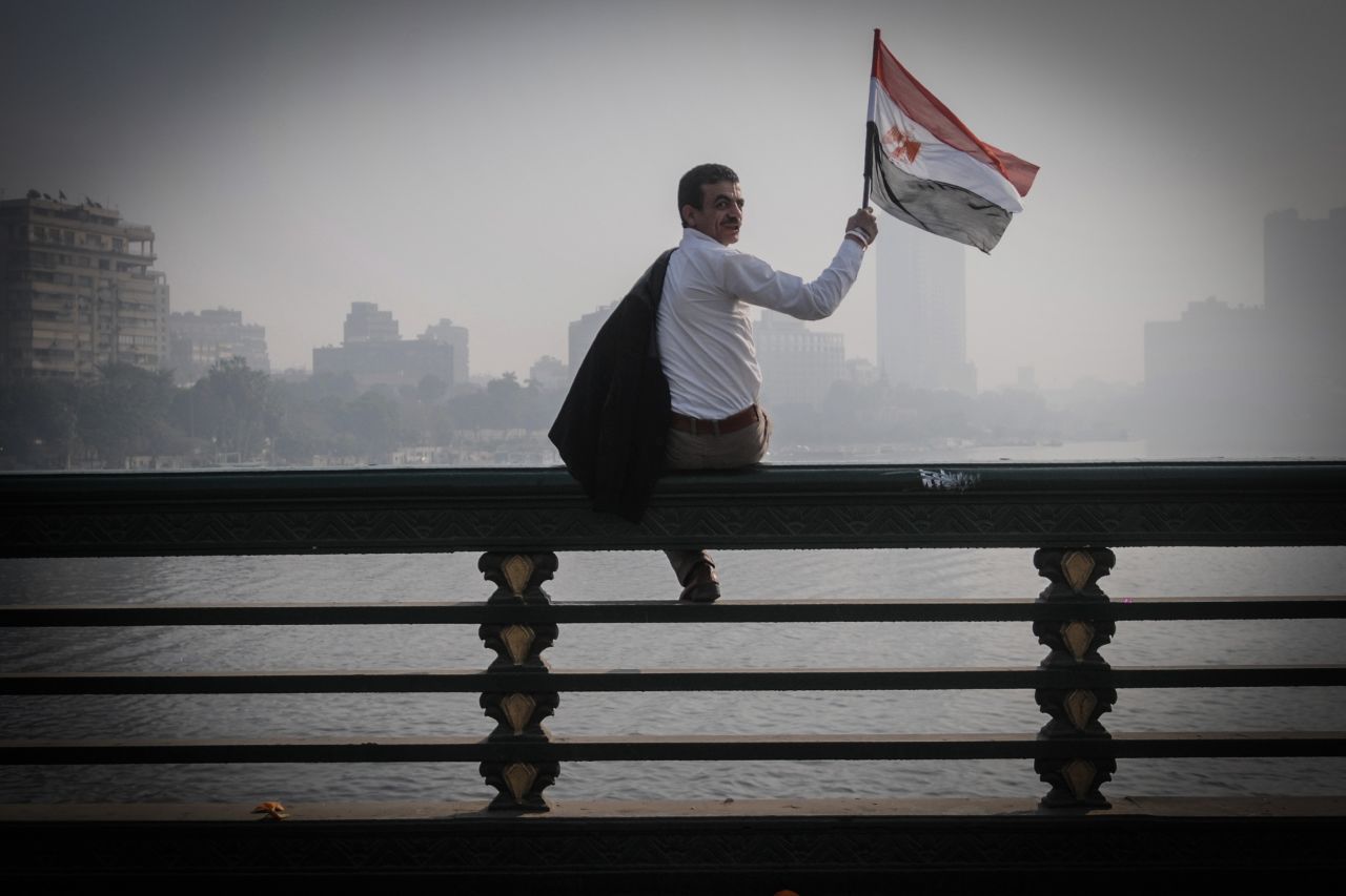 A man waves an Egyptian flag during a rally. 