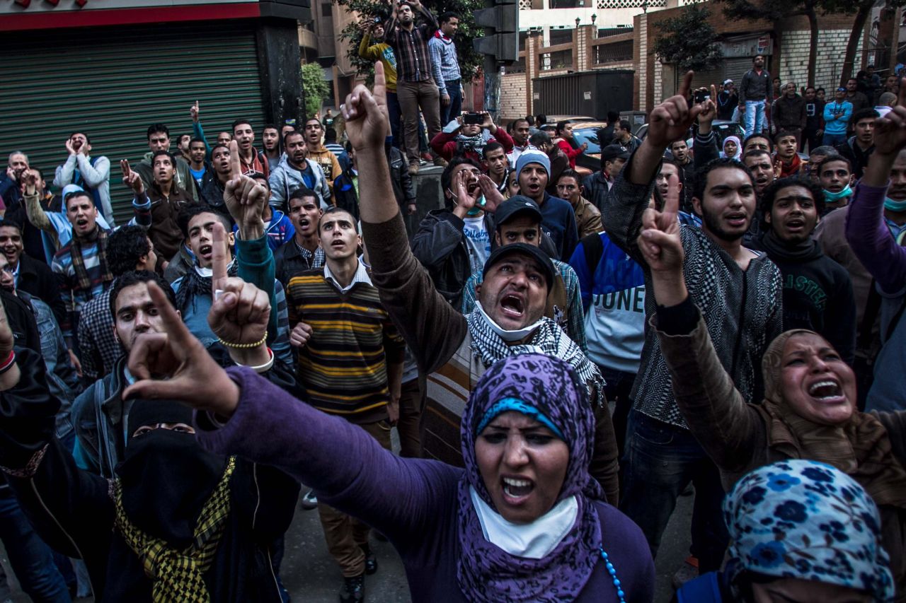 Anti-military protesters shout slogans near the Ramses Square in downtown Cairo.