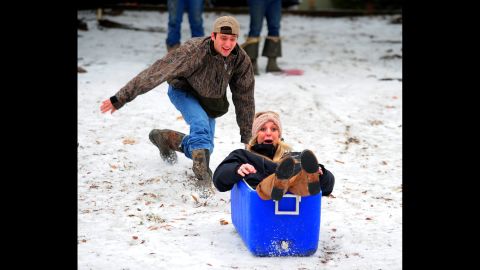 Ben Eggart pushes Hannah Graham down a hill at Girard Park in Lafayette, Louisiana, on January 24. 