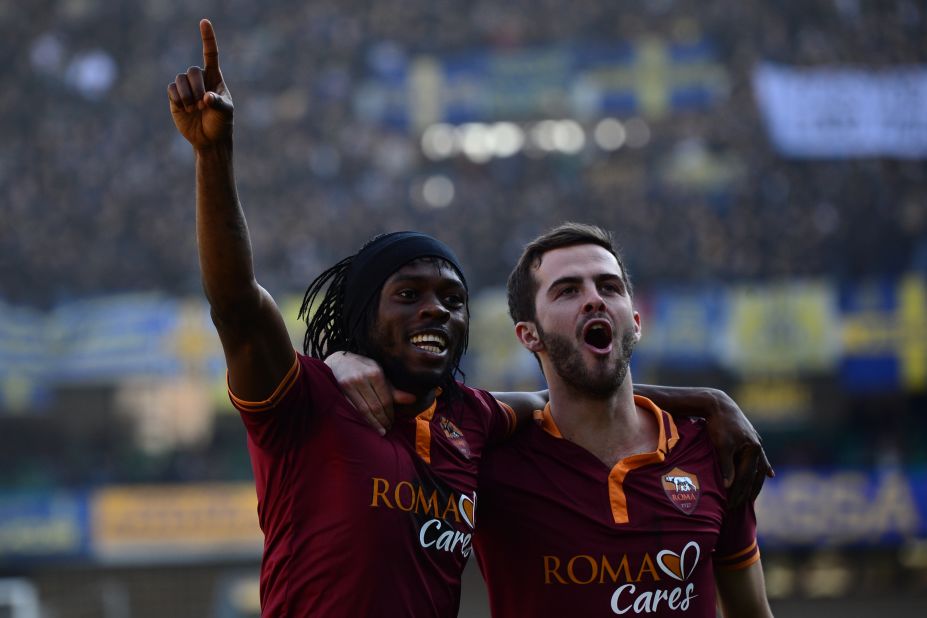Roma striker Gervinho (left) celebrates with teammate Miralem Pjanic. Both players have blossomed under Garcia's tutelage.